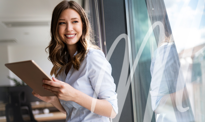woman on a tablet smiling