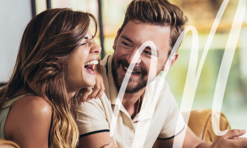 woman laughing hard with a man